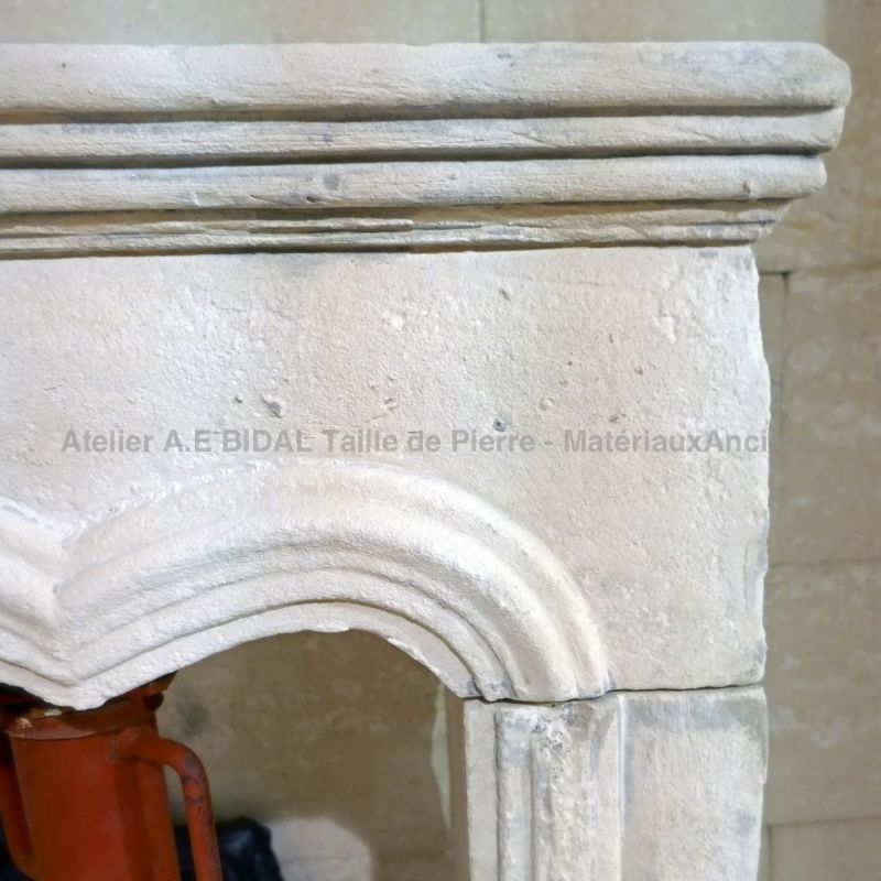 Antique Louis XV style stone fireplace for sale at Alain Bidal Antique Materials.