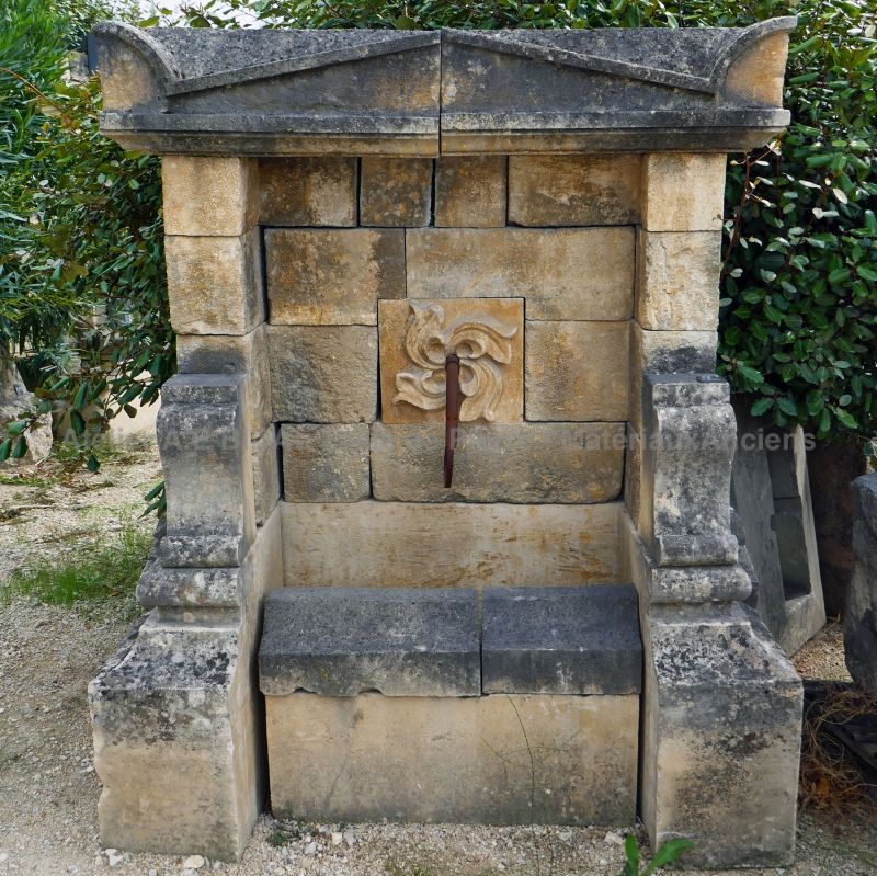 Wall fountain made of old stone - Original decorative fountain.