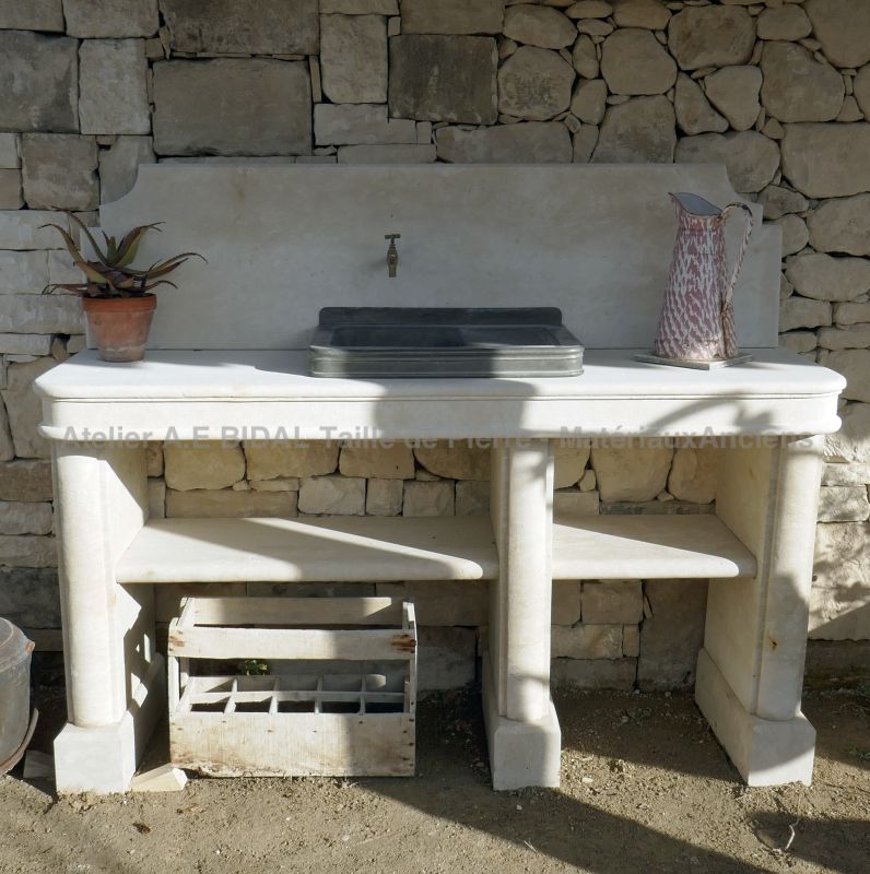 Summer kitchen made of natural stone with pewter sink by Atelier Alain BIDAL