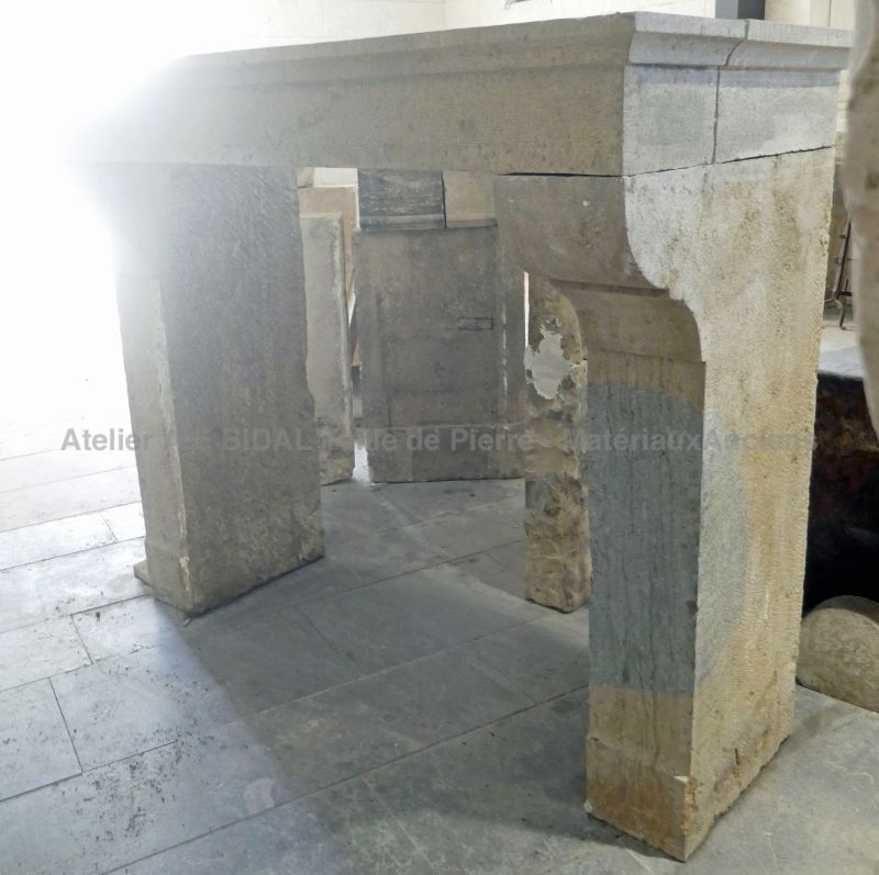 Antique stone mantel, an old fireplace with a refined design from Alain Bidal Matériaux Anciens in Provence