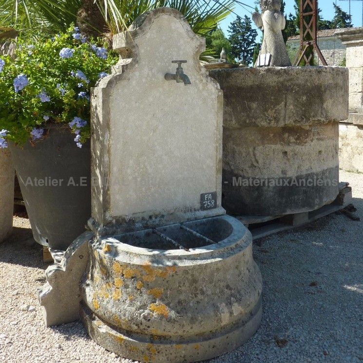 Water point or small fountain with pediment and basin - wall fountain.