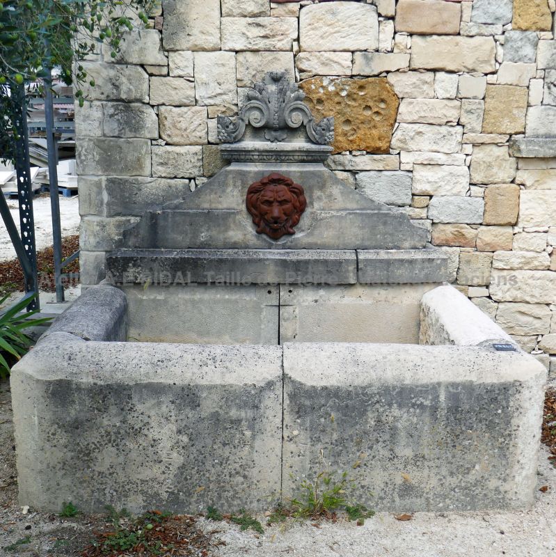 Wall fountain made of stone and cast iron | Fountain of Provence in reclaimed elements from the South of France.
