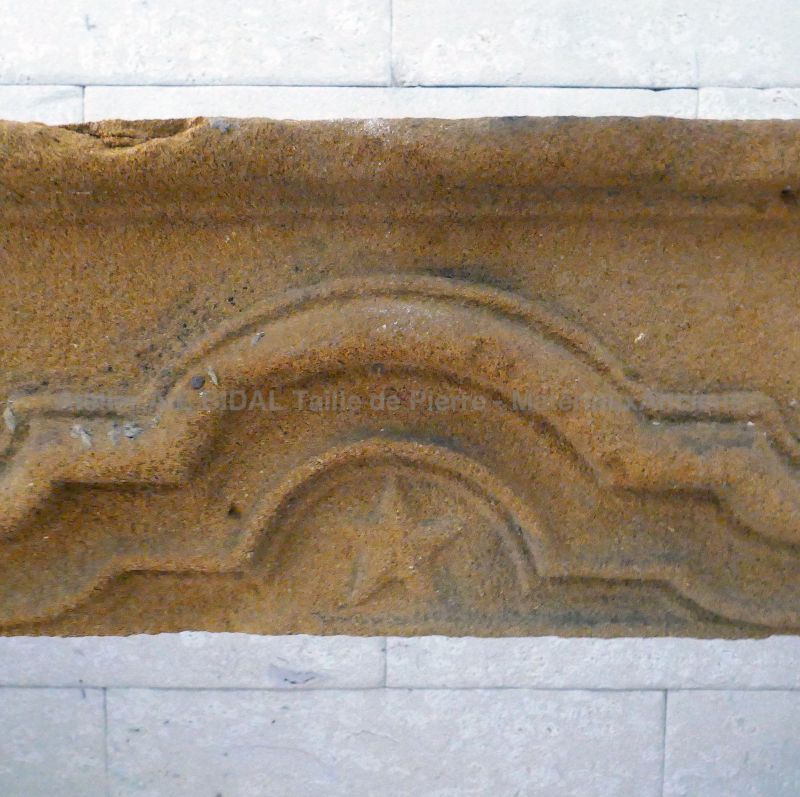 Detail of the central hand sculpted star on the lintel of our old stone fireplace : Atelier Alain BIDAL, Provence