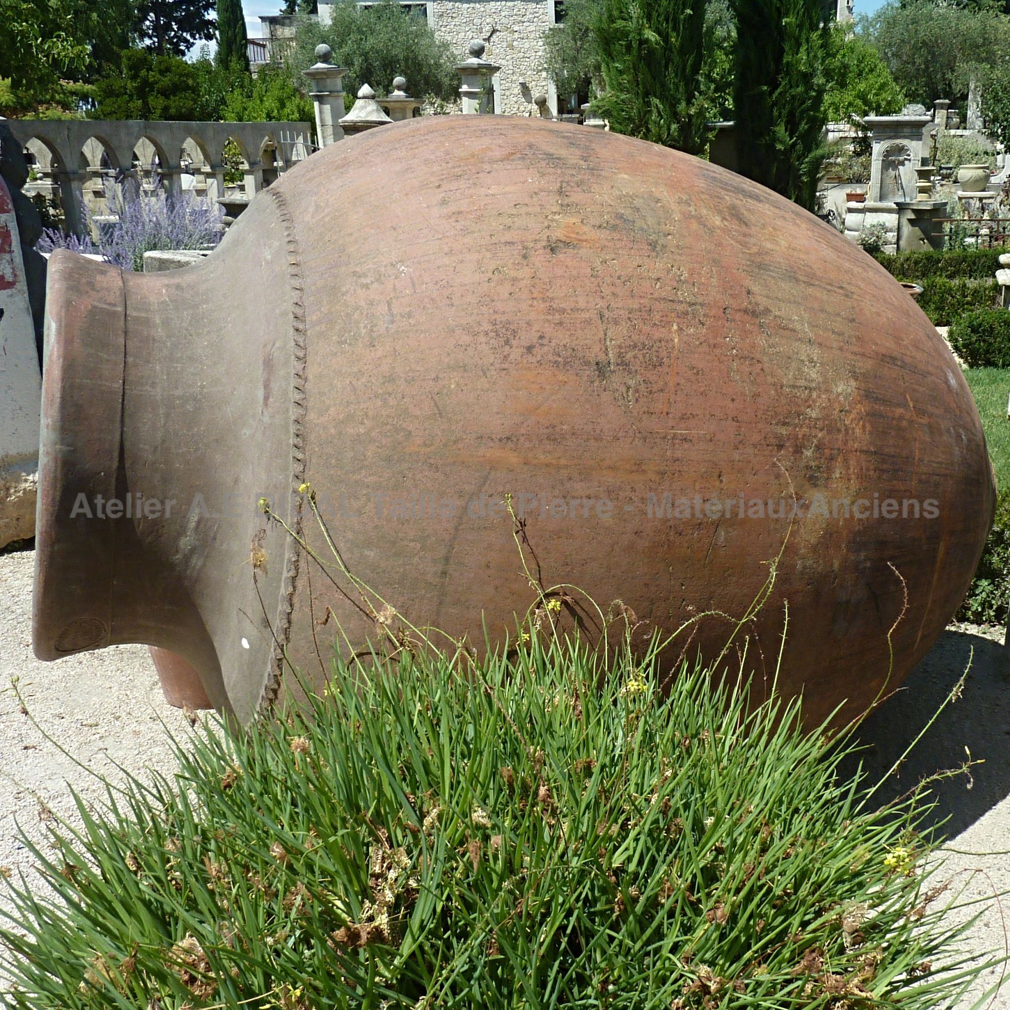 An ancient terracotta jar for an authentic garden decoration.