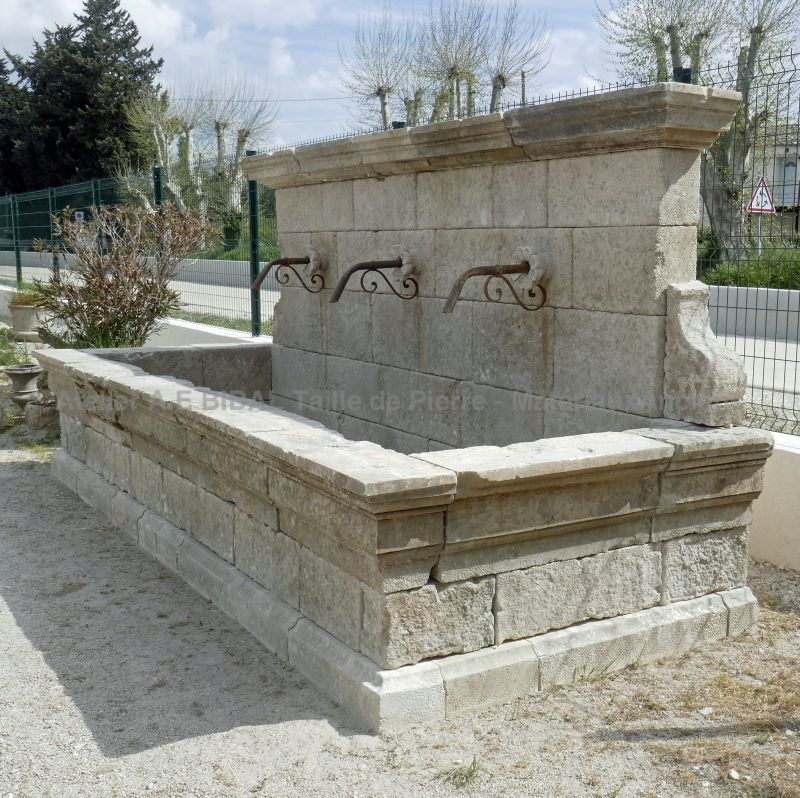 Beautiful rustic fountain in old stones by the stonemason in Provence Alain BIDAL