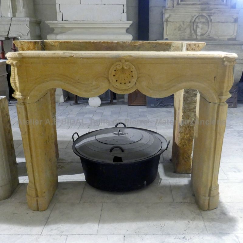 Antique Louis XV mantel in golden natural limestone for sale from a wide selection at Alain BIDAL - Provence