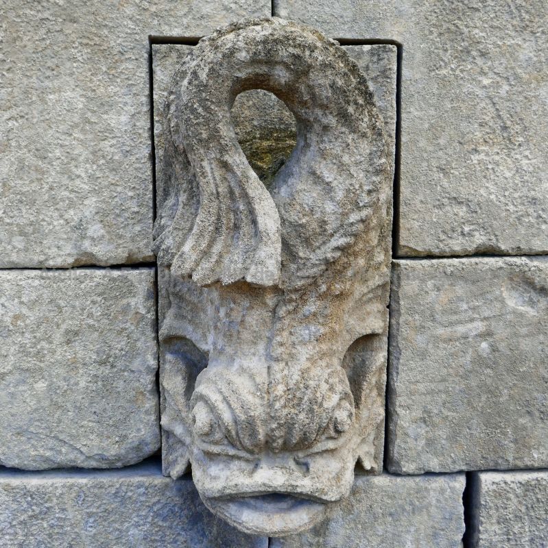 Detail of the stunning hand sculpted water spout on pediment of our garden wall fountain in aged stones