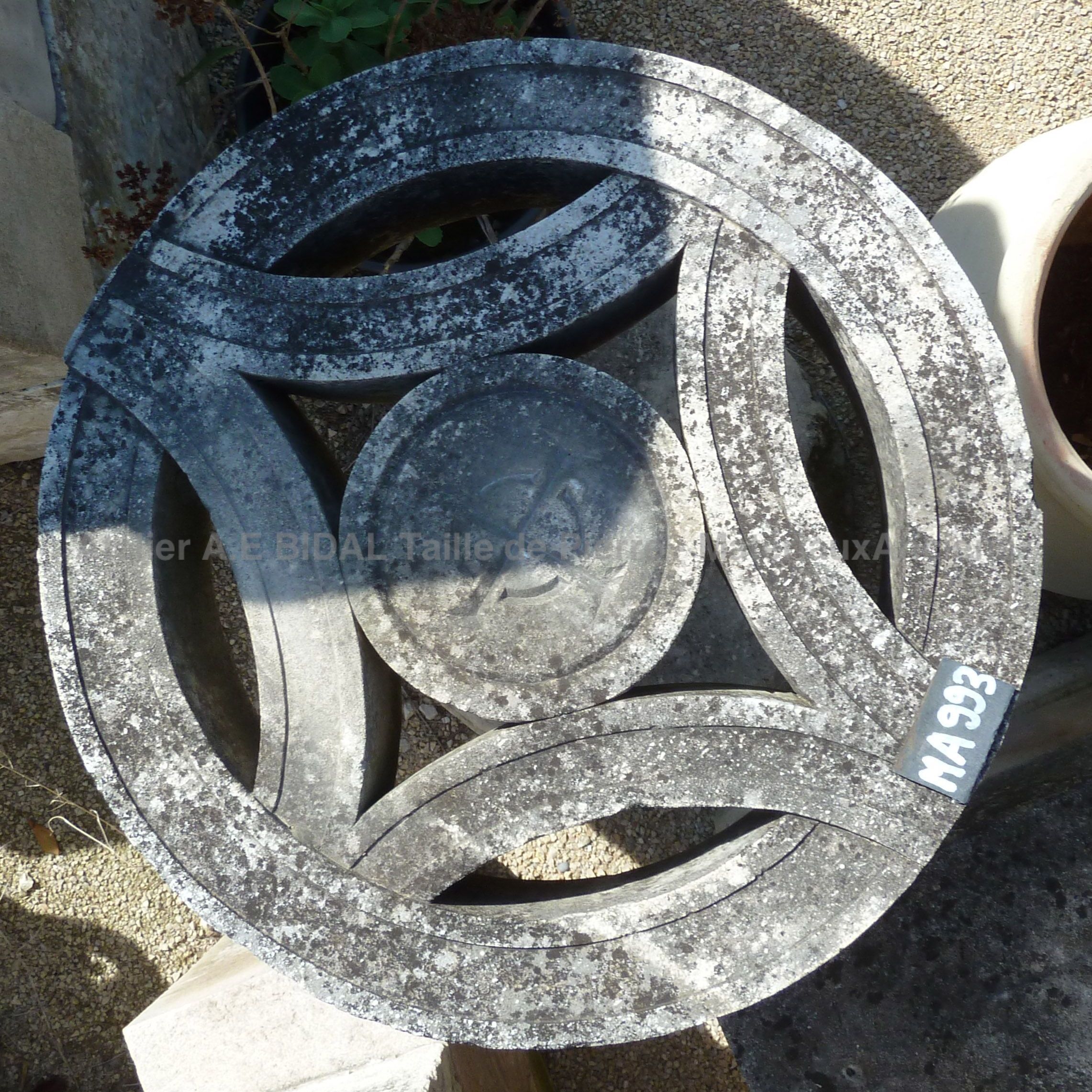 Detailed picture of the top table of hand sculpted in natural limestone.