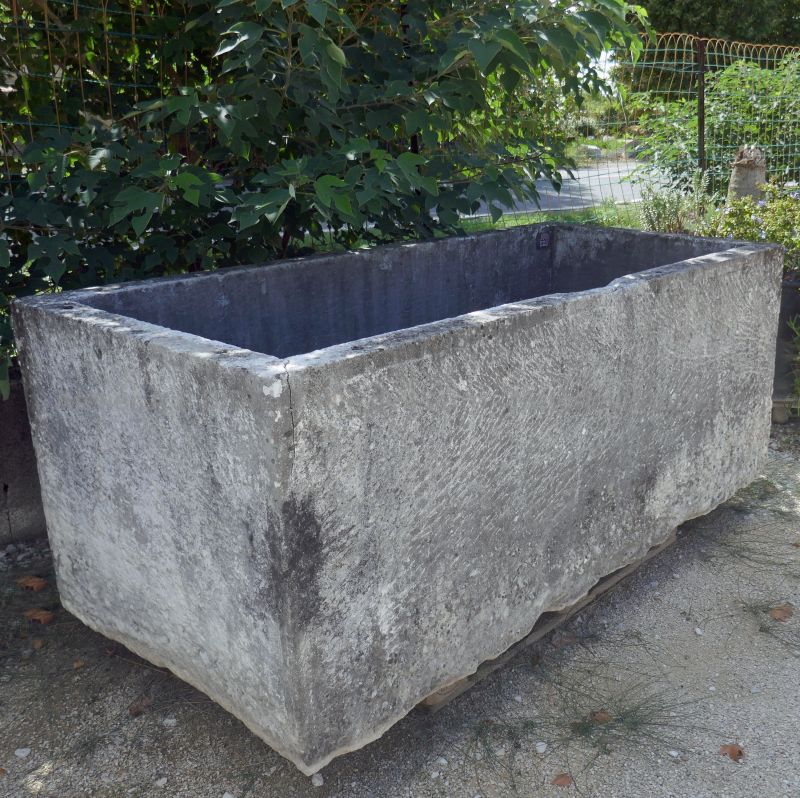 Large old stone trough for outdoor landscaping by Atelier Alain BIDAL