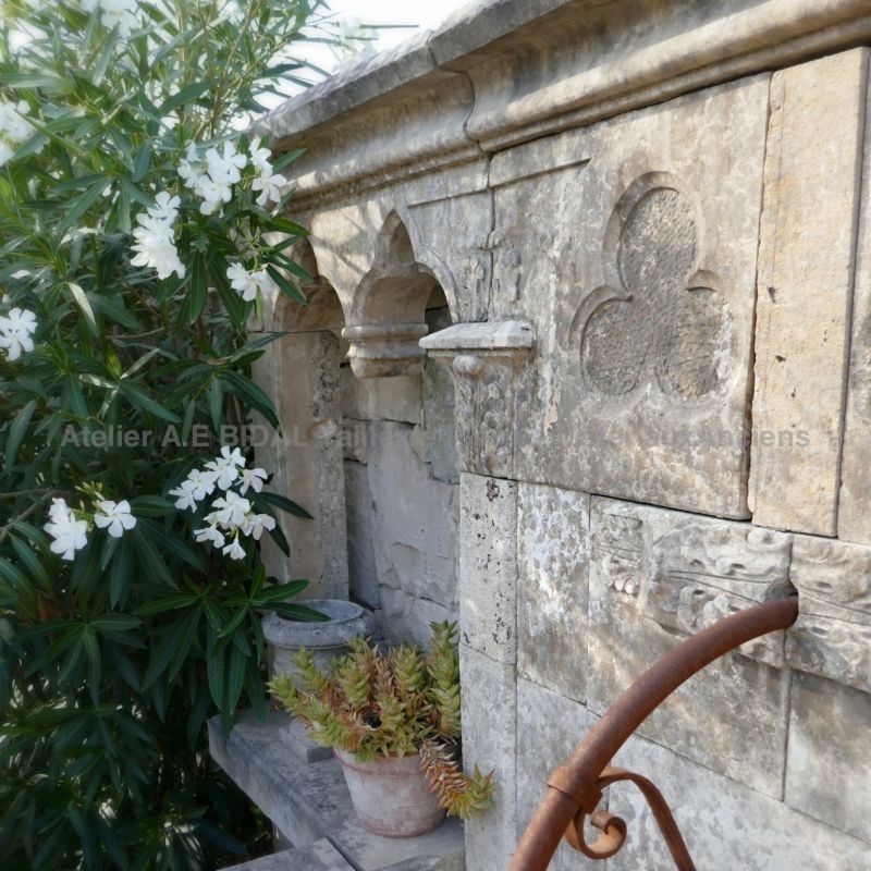 Fountain made of antique stones with a Gothic style inspiration