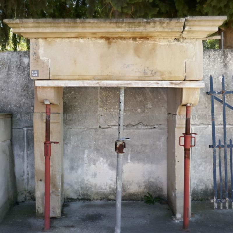 Rustic fireplace in a stone fireplace style - a Louis 13 fireplace with large dimension.