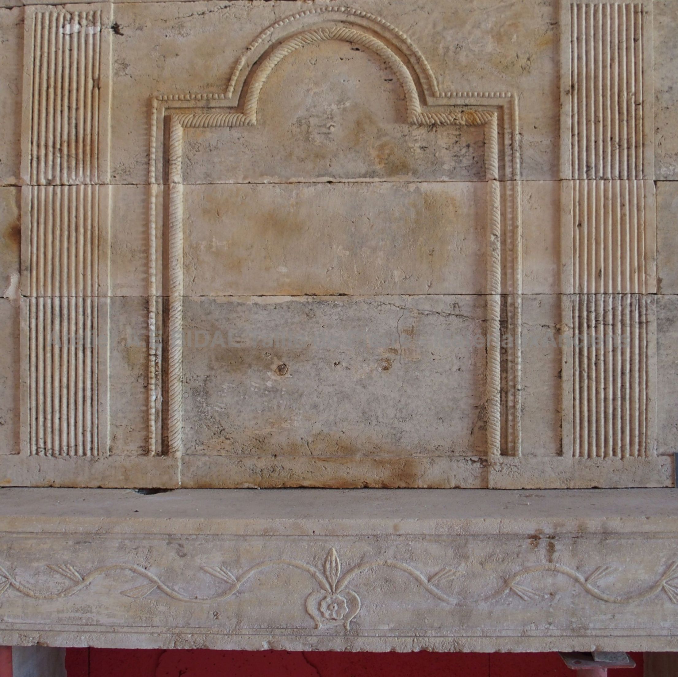 Old stone fireplace carved by a stonemason architect - Louis XVI fireplace made of old materials.