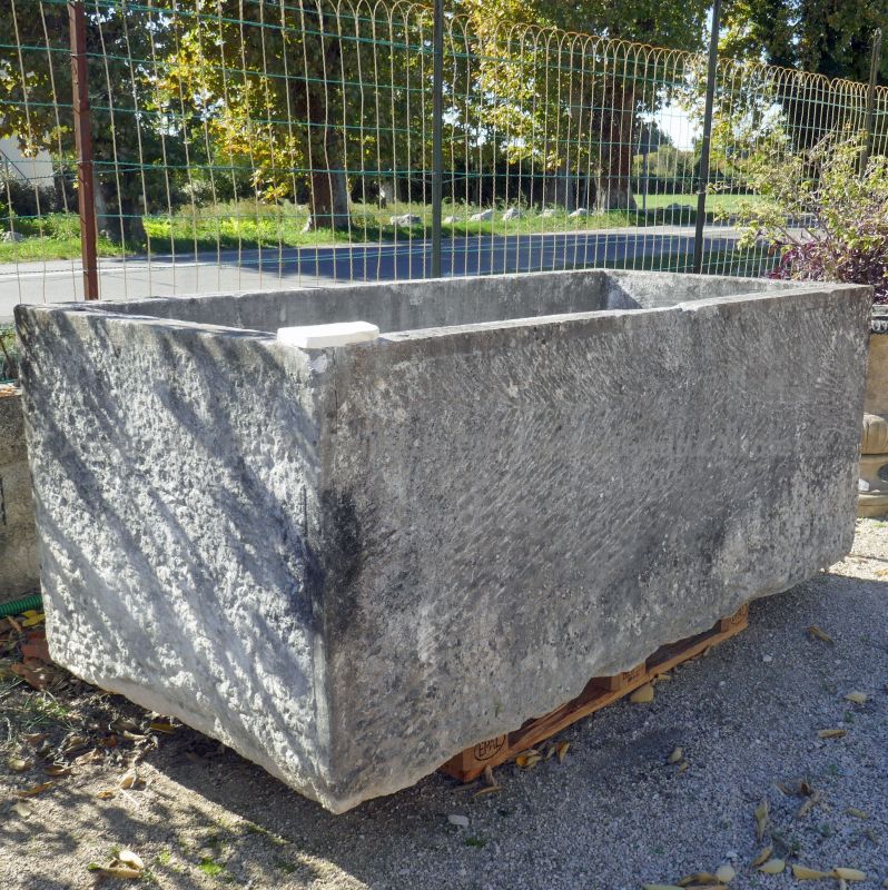 Large old stone trough for outdoor landscaping by Atelier Alain BIDAL