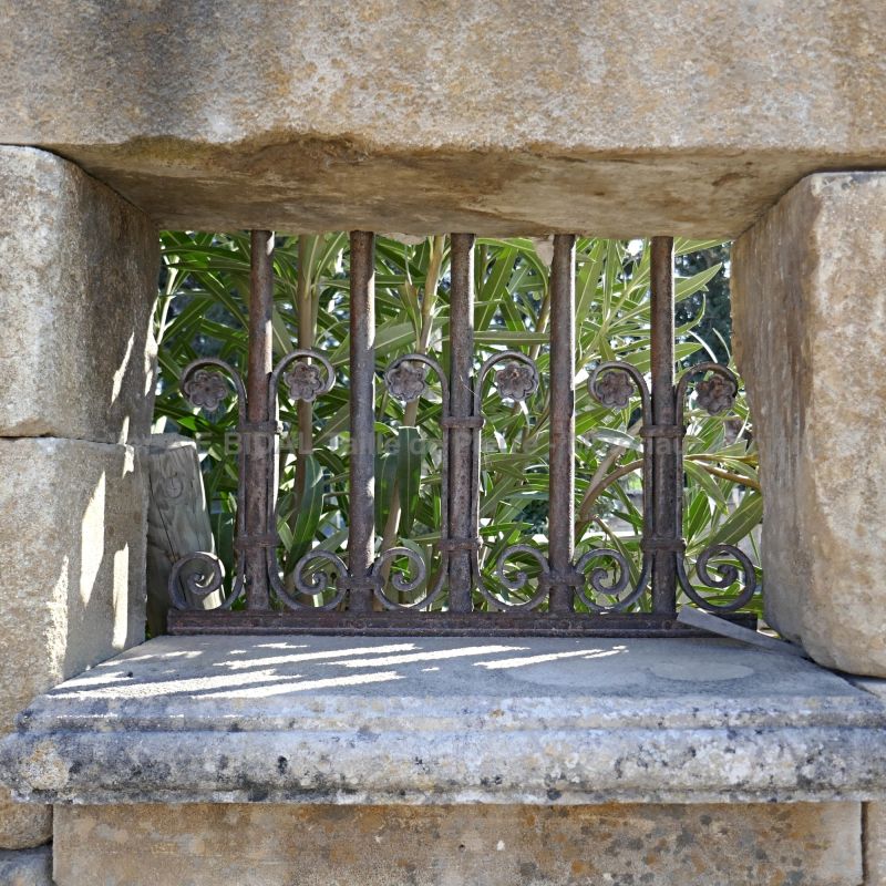 Detail of the window frame on our large garden fountain in stone and metal - Alain Bidal Antique Materials in Provence