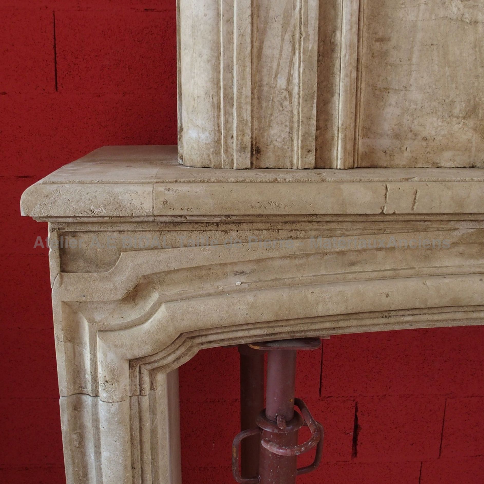 Fireplace with overmantle, a decorative fireplace made of old materials.