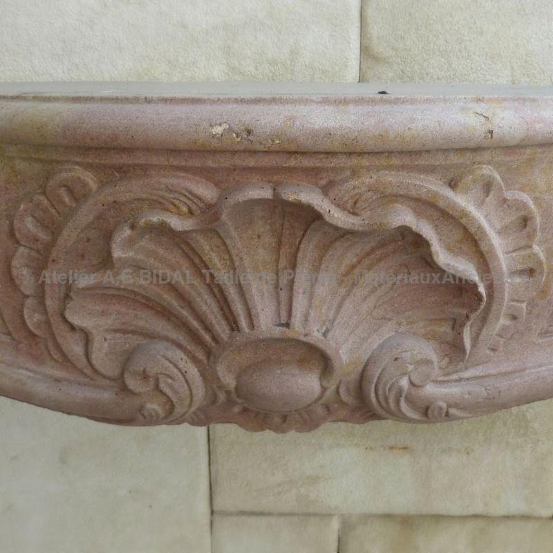 Antique fireplace - a stone fireplace carved with care.