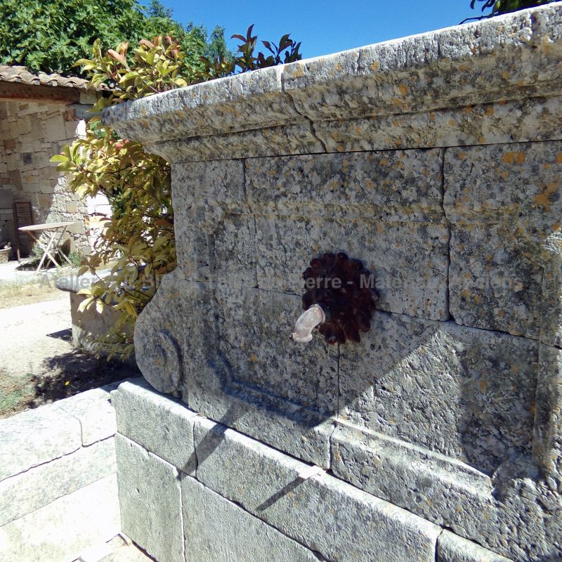Picture of the pediment of our large wall fountain in aged and patinated stones