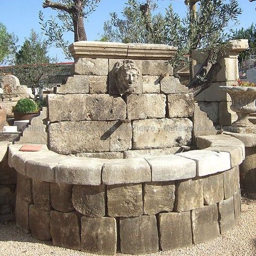 Wall-fountain with semi-circular basin