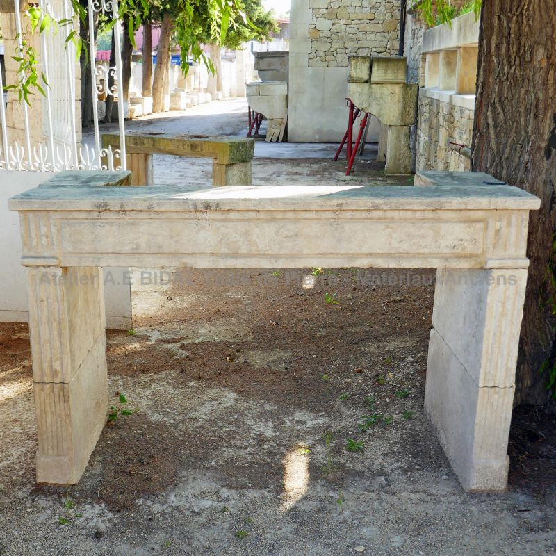 Louis XVI fireplace - an antique mantle full of charm.