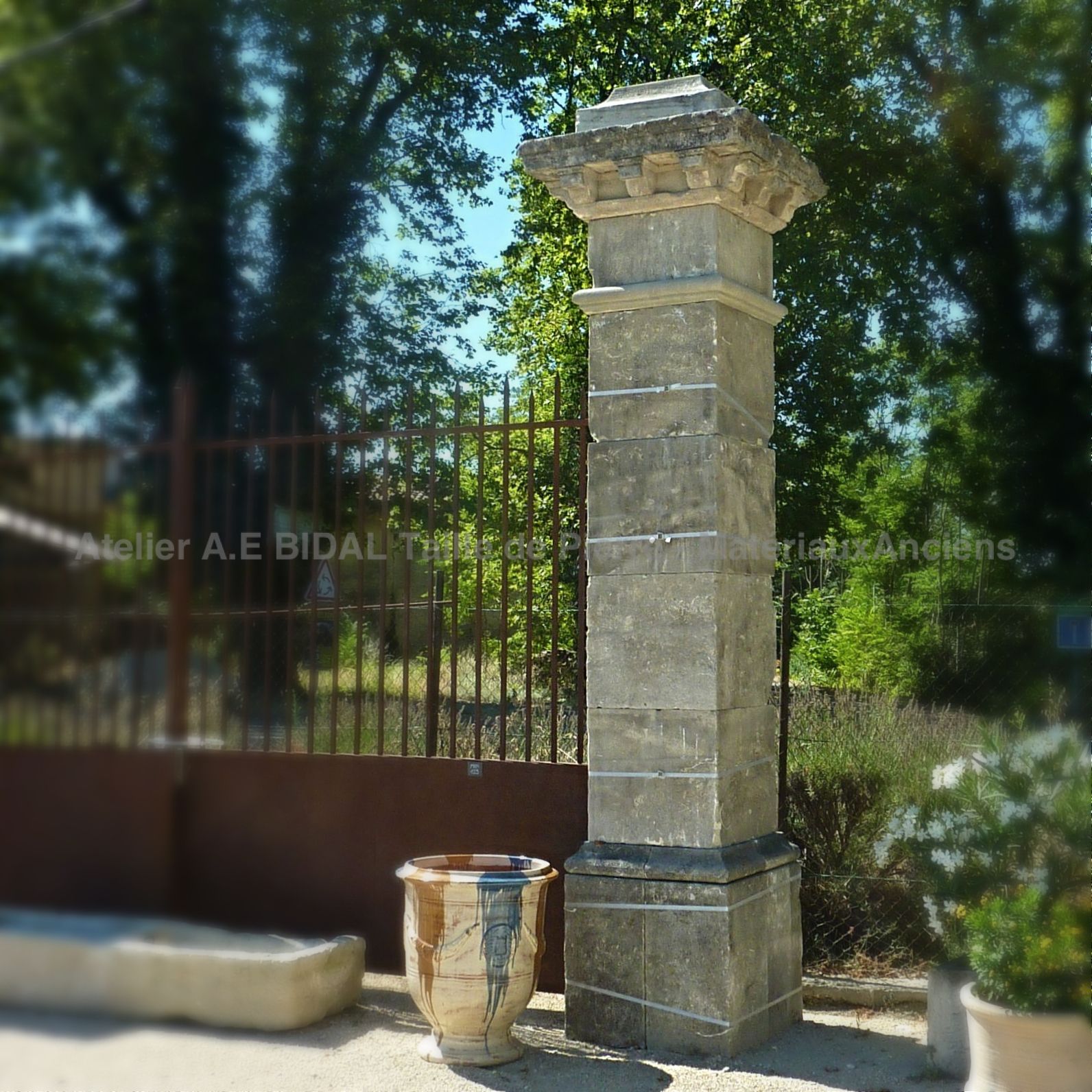 Ancient pillar with sculpted capital - pair of old natural stone pillars.