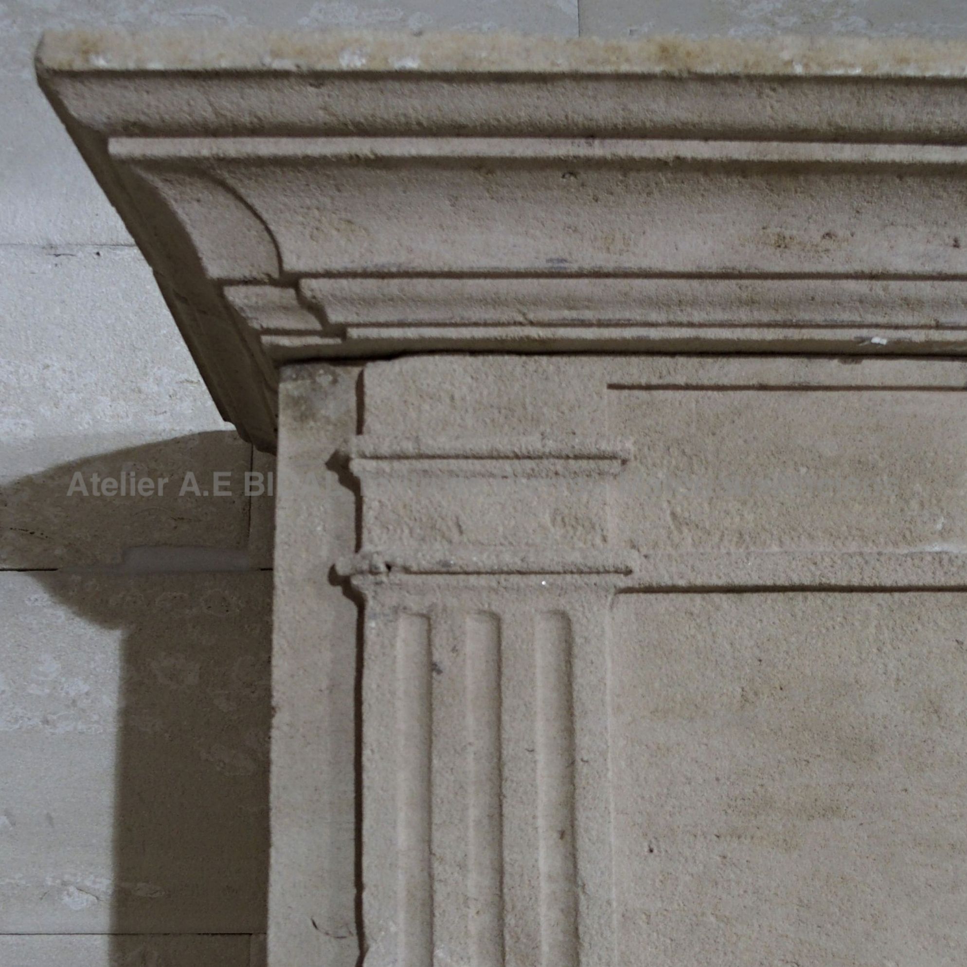 Louis 16 Fireplace - A natural stone fireplace with overmantle.