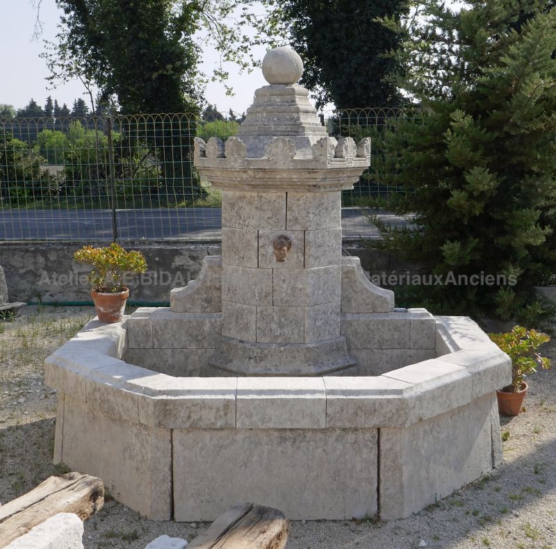 Large garden fountain with basin, column and hand-sculpted capital for sale at Alain BIDAL Antique Materials - Provence.