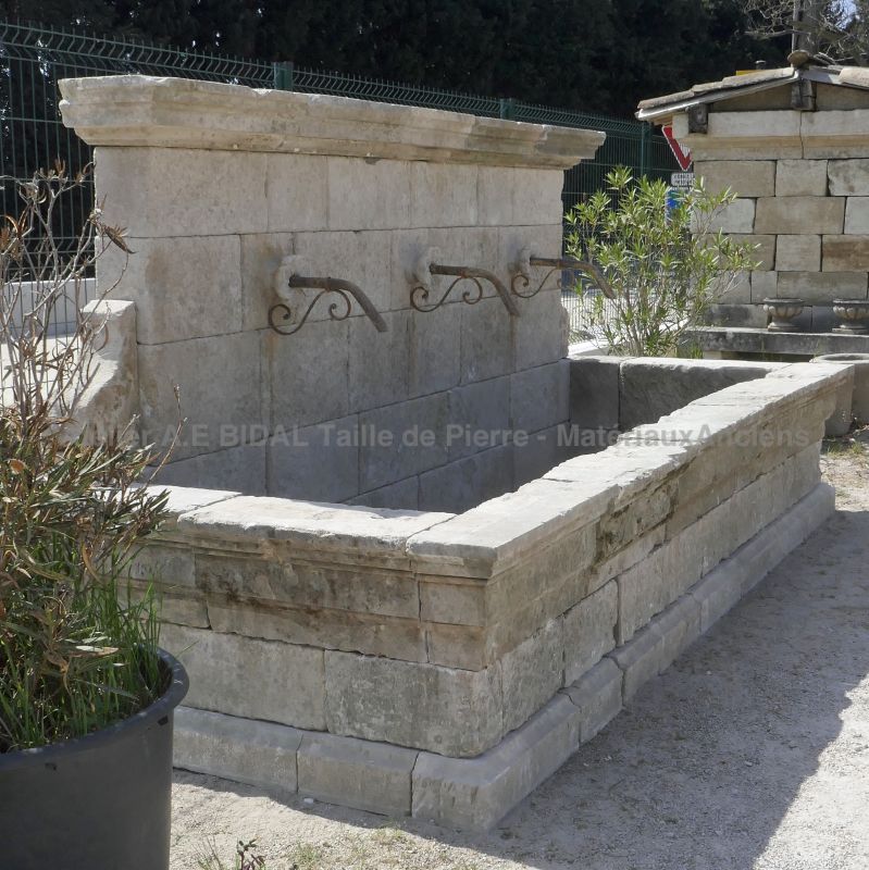 Large rustic fountain in weathered stones by the stonemason in Provence Alain BIDAL