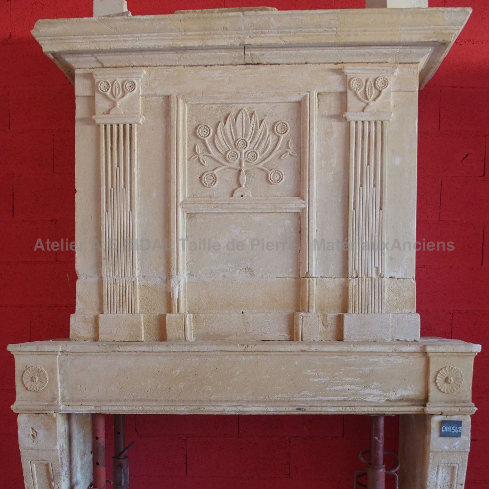 Louis XVI fireplace - an old fireplace in Louis XVI style made of stone.