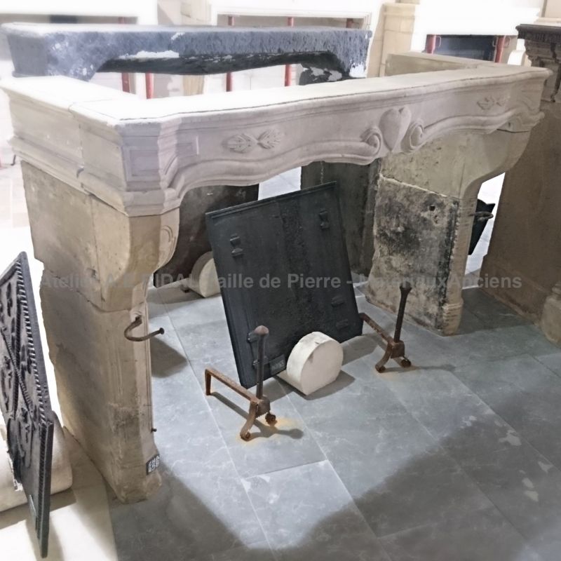 Antique fireplace in real stone - fireplace formerly sponsored for an engagement.