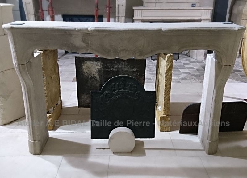 Old fireplace made of white hard stone - an old fireplace called "Regency".