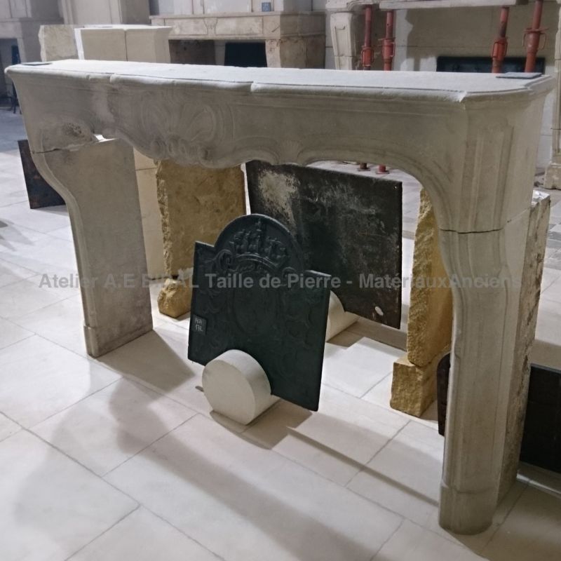 Antique white stone fireplace - Natural stone fireplace of French Regency style.