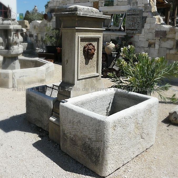 Central fountain in a whitish natural stone | Decorative fountain in aged natural stones.