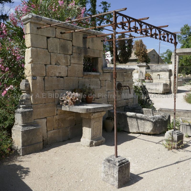 Beautiful wall fountain can be used for the development of a living area next to a pool.