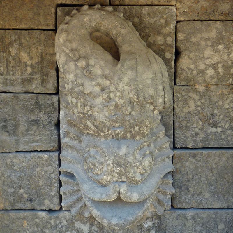 Sculpture on our large antique garden wall fountain with double basin.