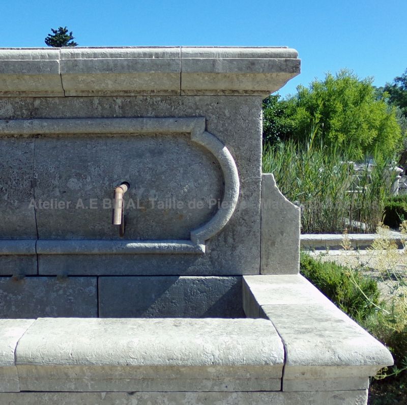Wall fountain in stone with three water outlets in wrought iron : large outdoor fountain with deep basin and carved pediment