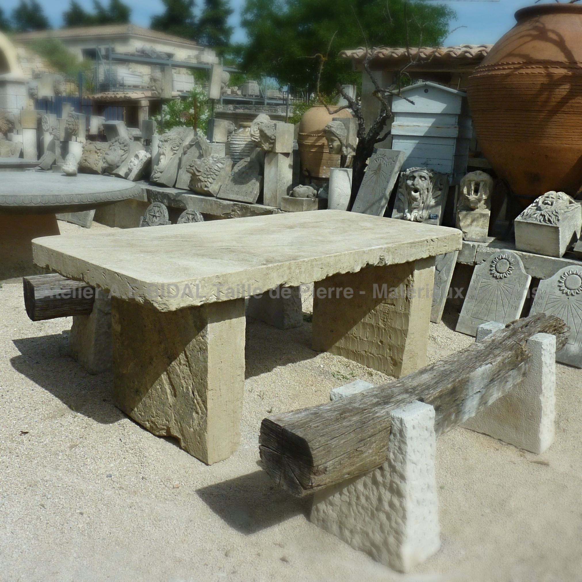 Antique garden furniture by Bidal - large rectangualr table made of reclamed materials.