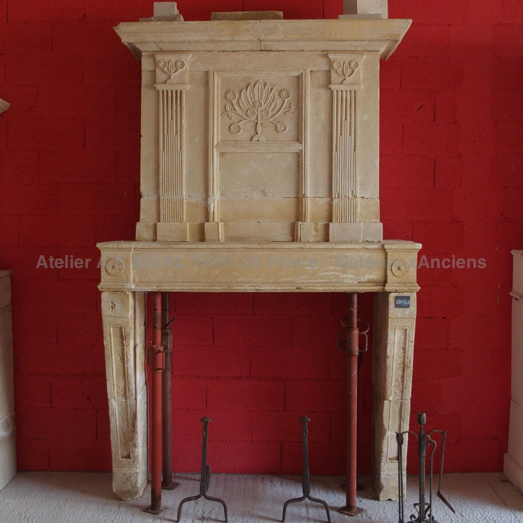 Louis XVI fireplace - a fireplace with overmantl made of Charentes natural stone.