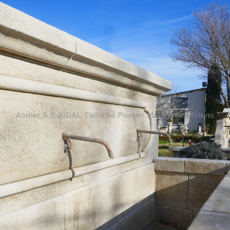 Antique-looking French wall fountain for landscaping on sale in Provence at Atelier Alain BIDAL.
