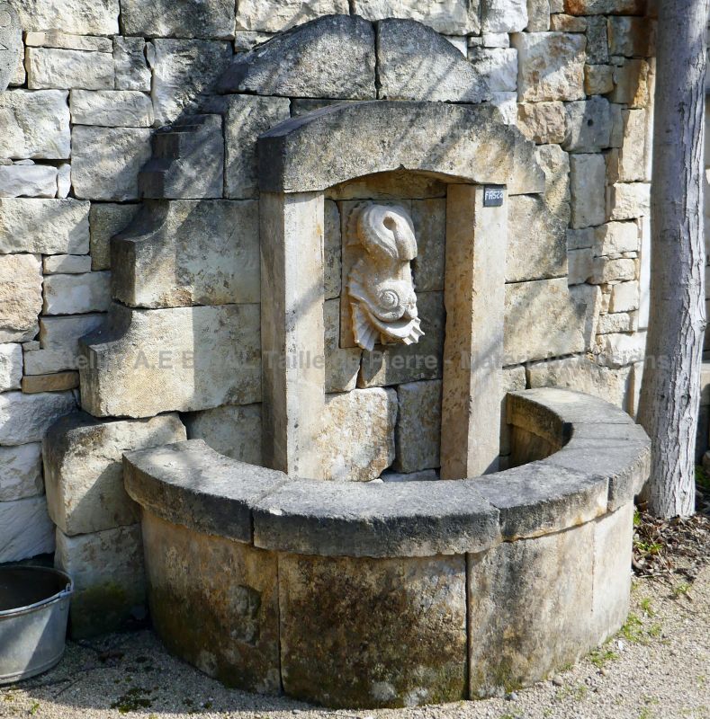 Wall fountain with an unusual style - unique garden fountain for a nice garden decoration.