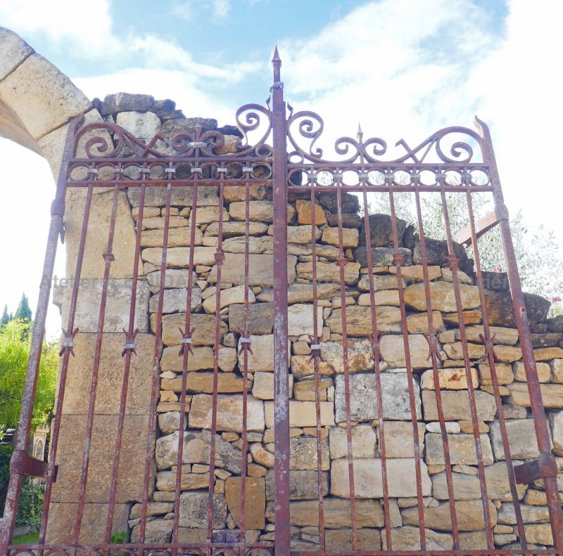 Old wrought iron gate : a tall gate with 2 doors for sale in Provence at Atelier Alain BIDAL