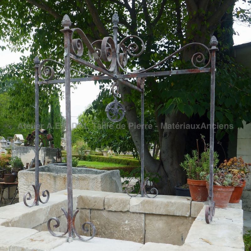 Photo of the old wrought iron well-top on our square stone well - Atelier Alain BIDAL