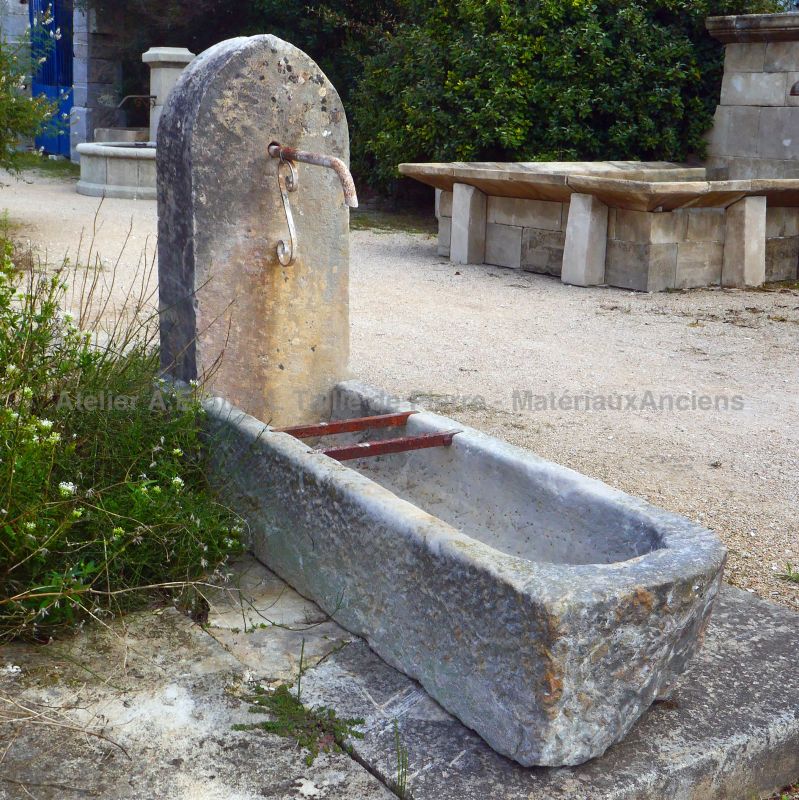 Garden fountain in weathered stones - Wall fountain in natural stone for sale at Atelier Alain BIDAL (Provence)