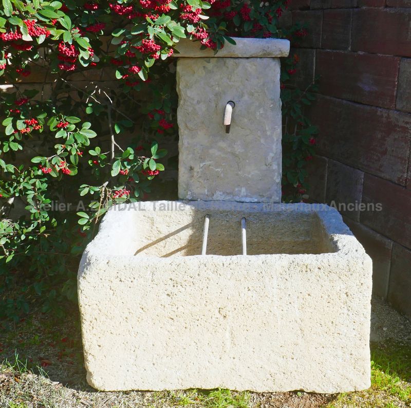 Garden fountain in reclaimed weathered stones with old trough for sale at Atelier Alain Bidal (Provence)