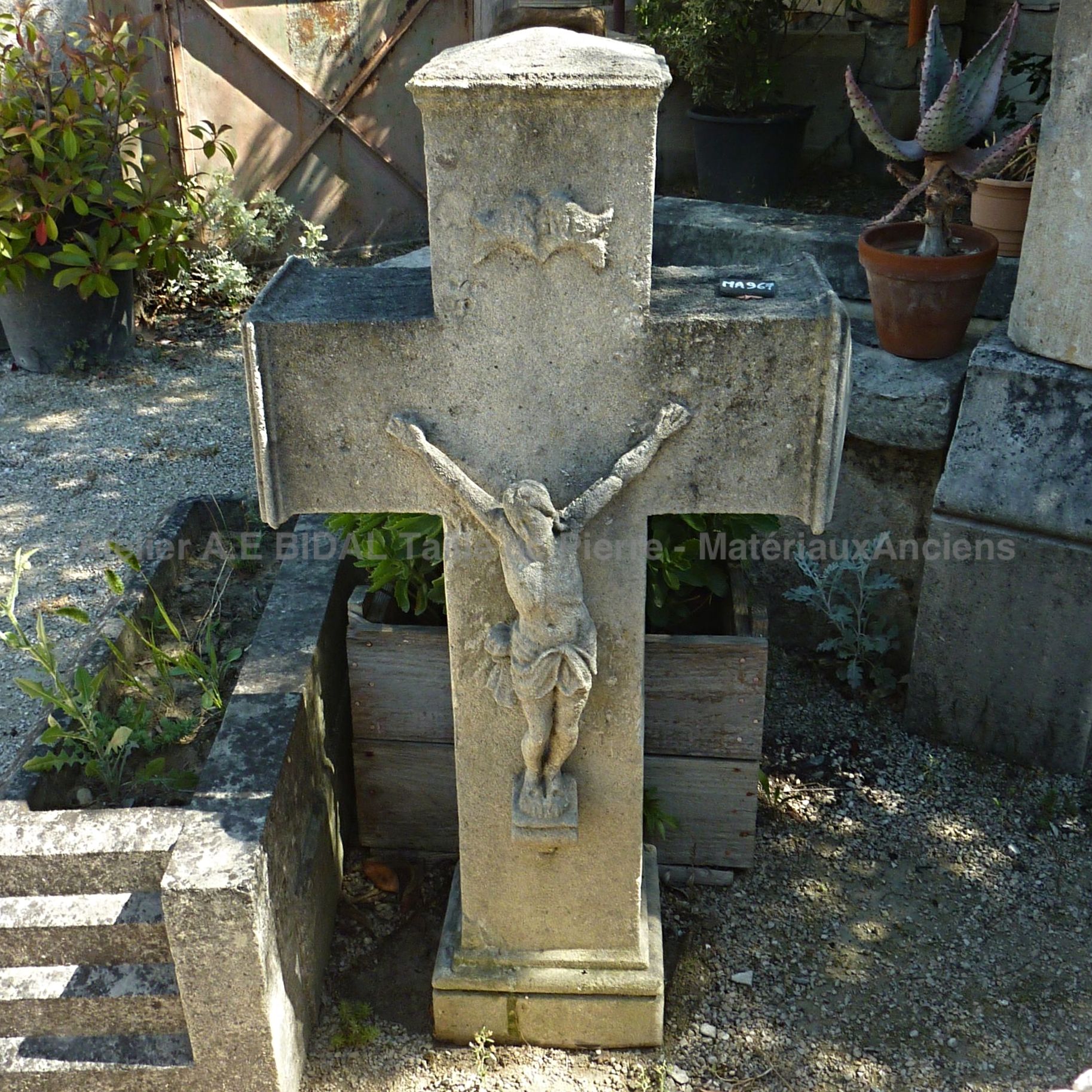 Beautiful old cross - a stone cross on a pedestal with Christ.