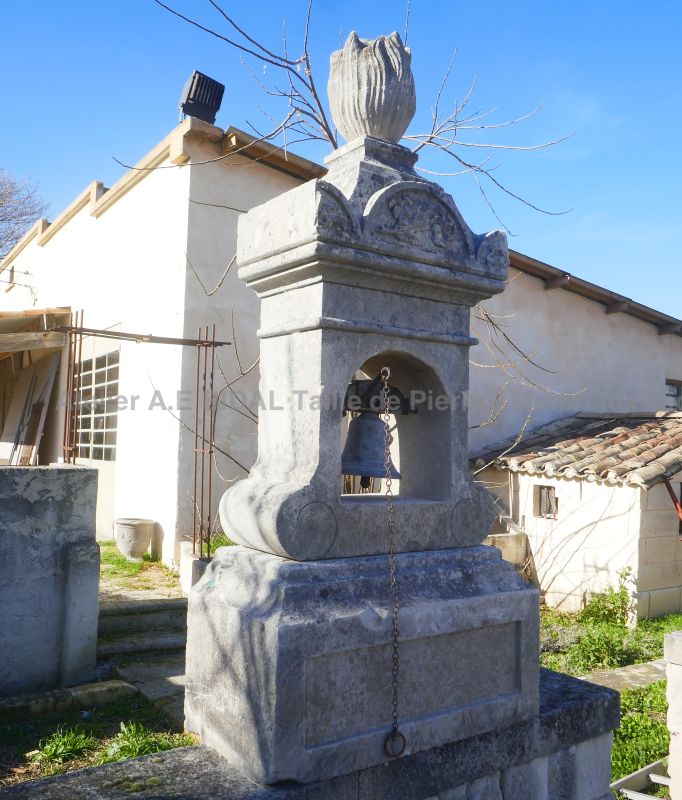 Stone bell tower and its old bronze bell - A fine garden ornament for sale at Alain Bidal in Provence