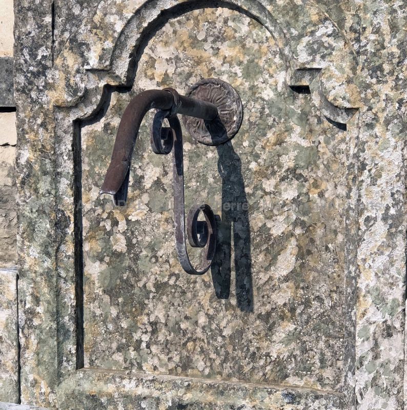 Details of the patinated stone pediment on our garden wall fountain - Alain BIDAL Antique Materials in Provence