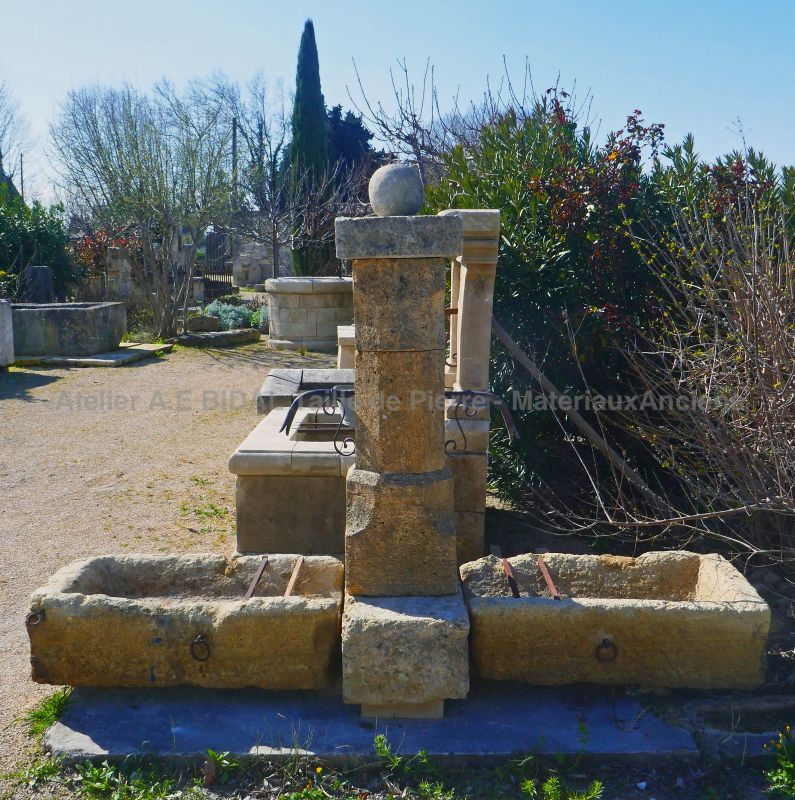 Rustically charming outdoors fountain : a natural stone fountain for garden decoration.