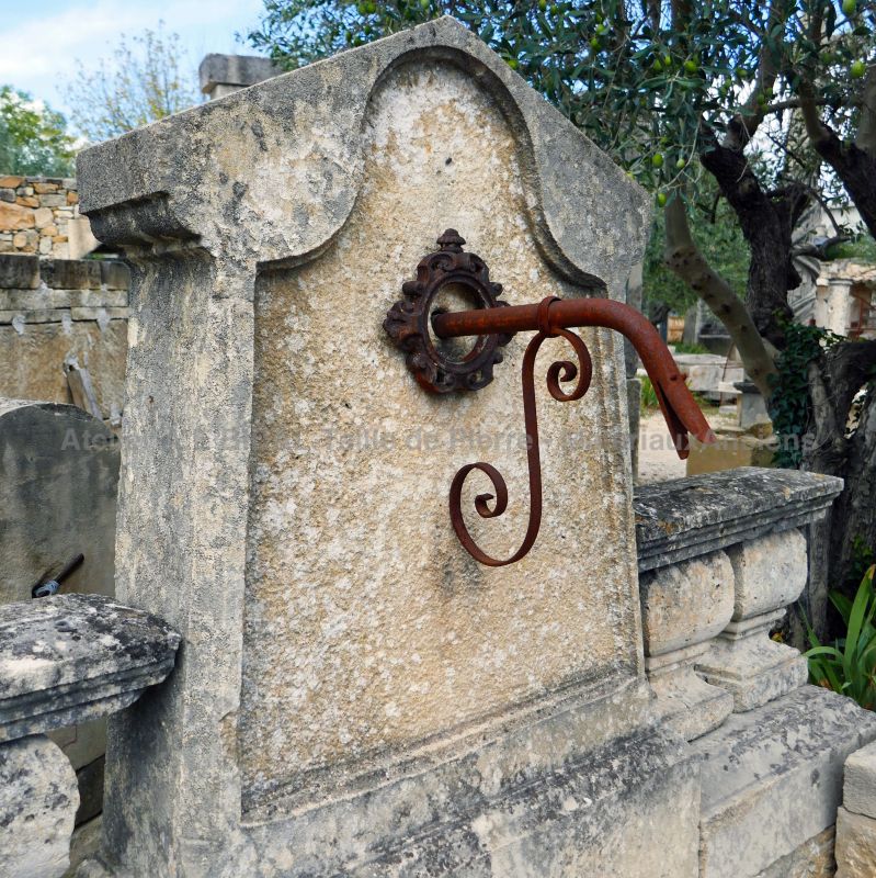 Detail of the pediment on our old stone fountain by Alain BIDAL Antique Materials in Provence.