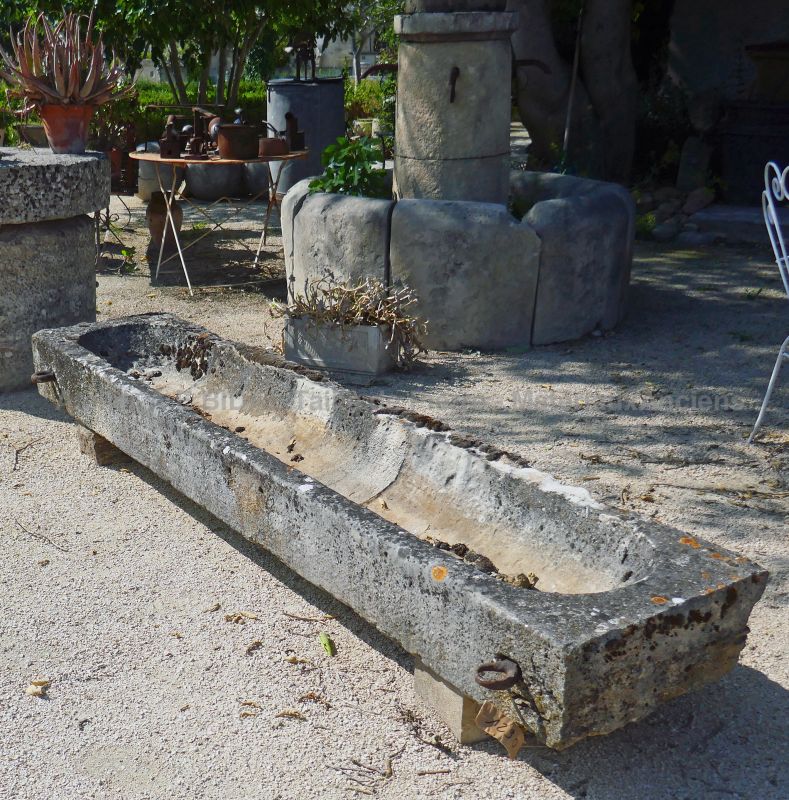 Long and shallow trough in patinated stone by Alain BIDAL Antique Materials in Provence
