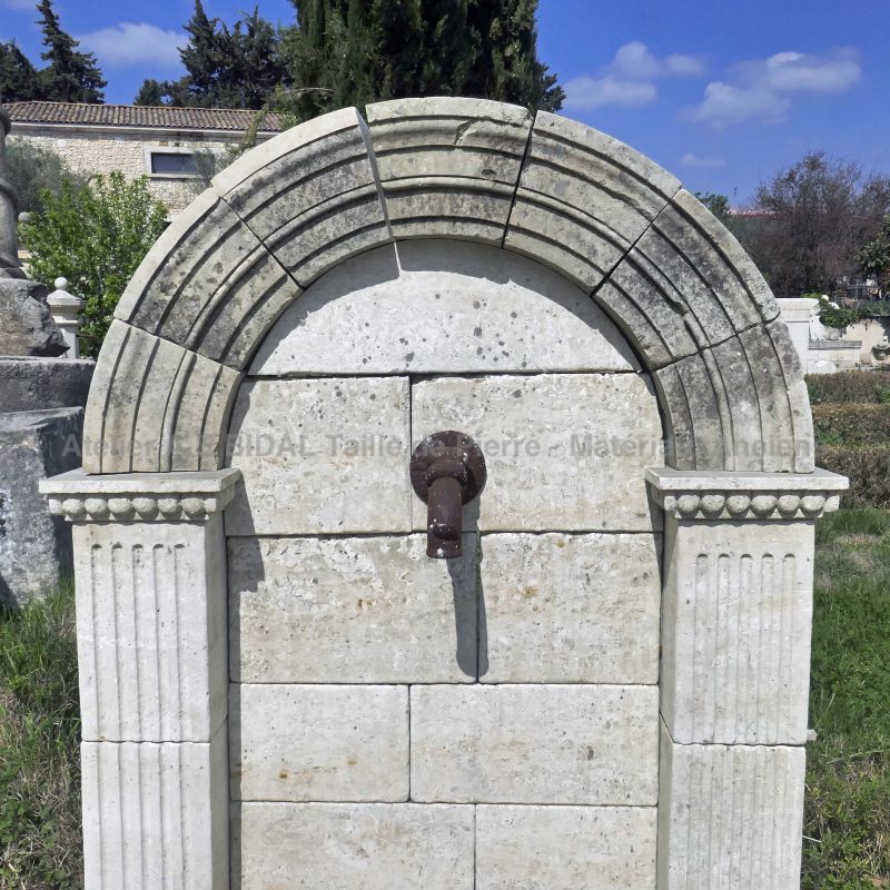 Garden fountain with finely sculpted pediment and shallow basin : Atelier Alain BIDAL, Provence
